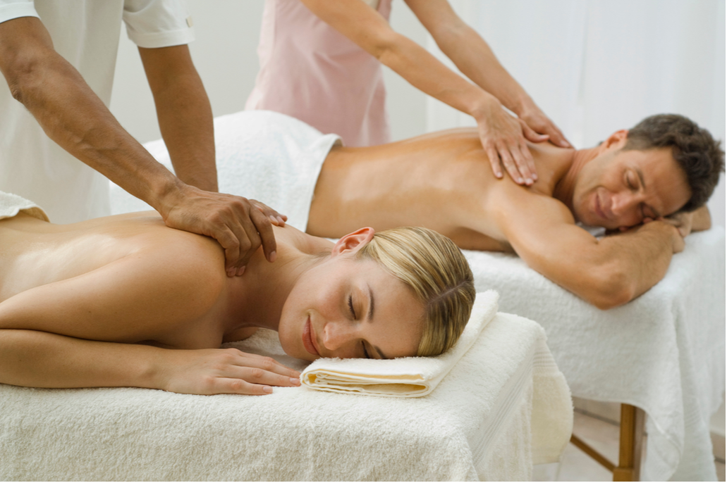 A man and a woman receiving a couples massage