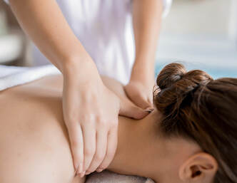 A woman receiving neuromuscular massage therapy