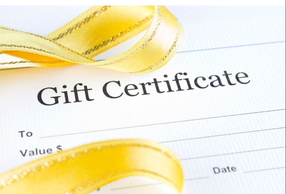 A picture of a blank gift certificate with a yellow ribbon on it